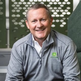 John C. May, Chief Executive Officer, Chairman and President of John Deere